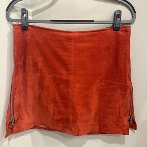 Orange suede skirt with zipper details